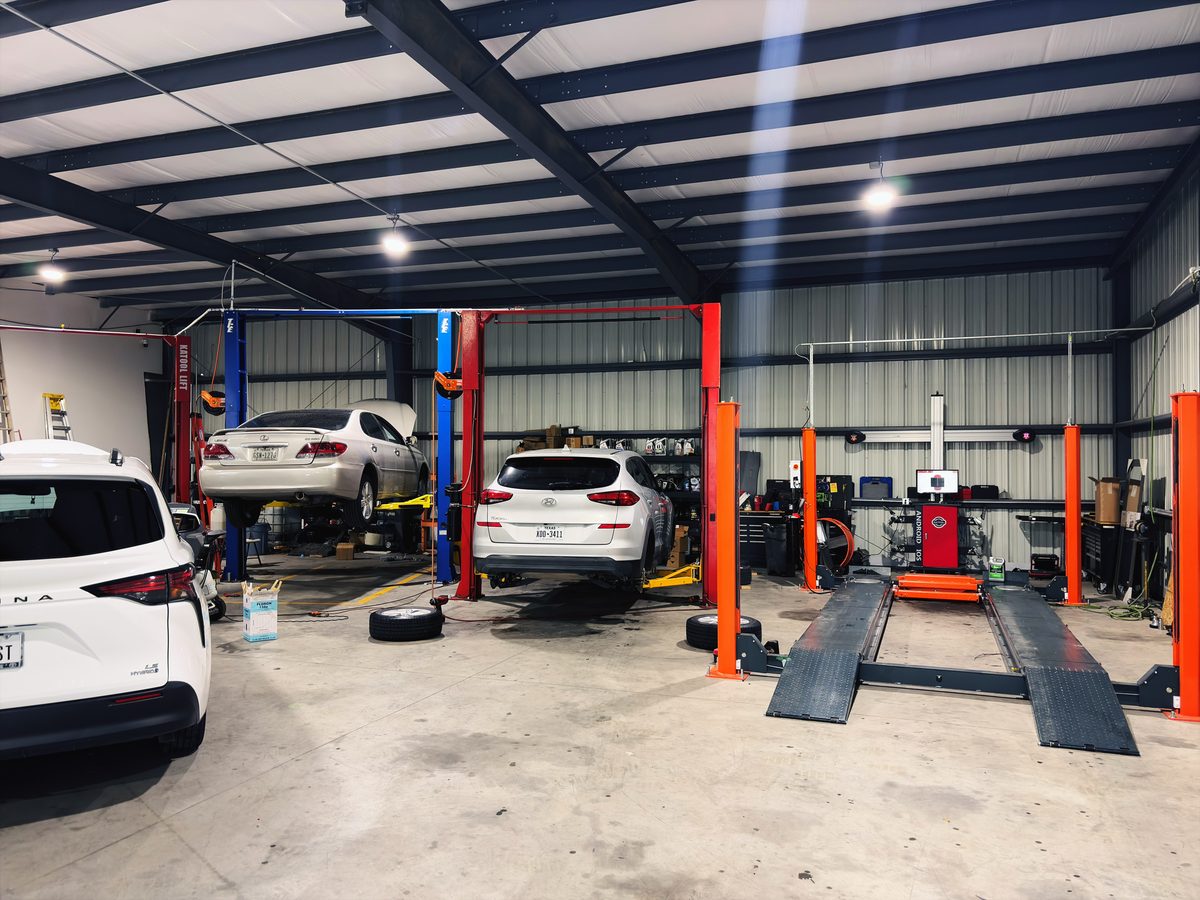 Busy shop floor with multiple vehicles