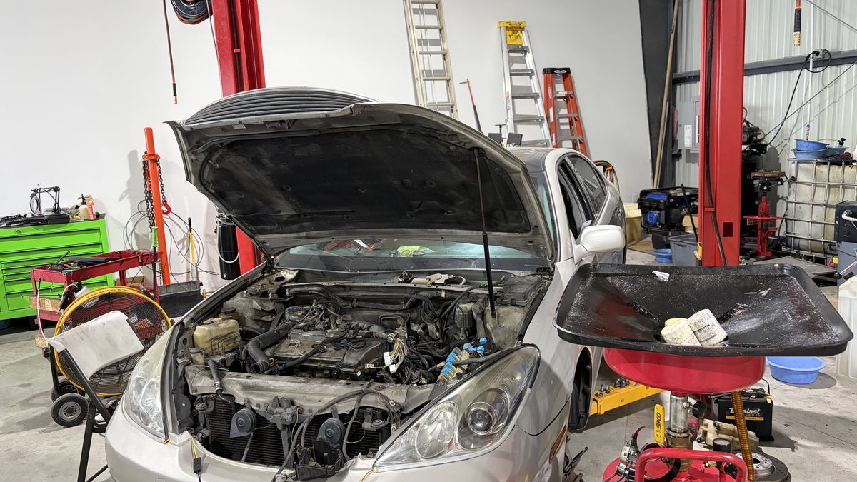 Technician working on vehicle
